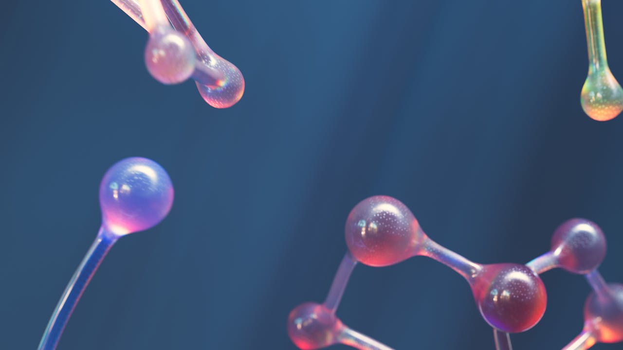 about-02 Abstract image of connected molecular shapes with vibrant colors.